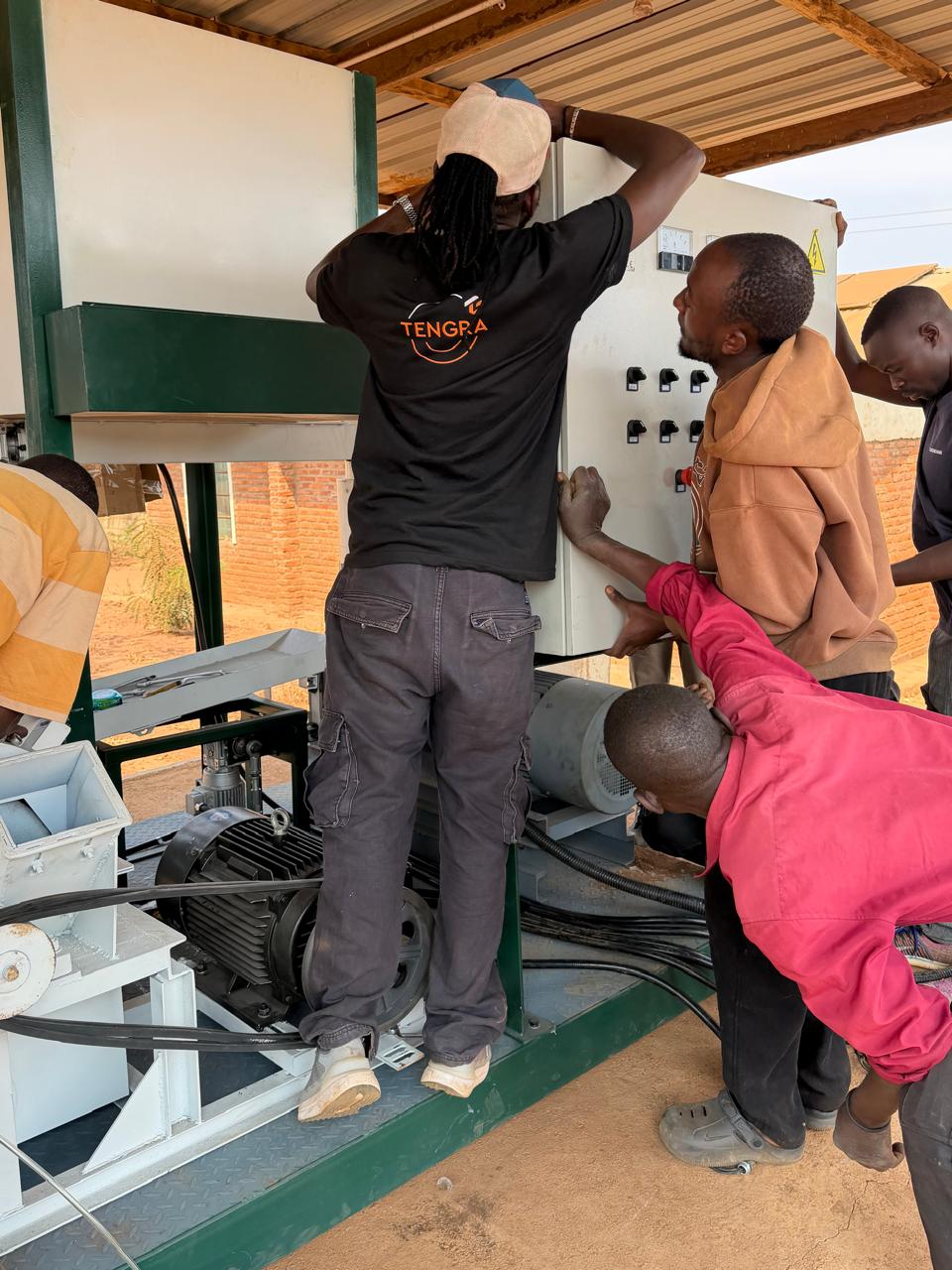 AIE engineering team installing an industrial electrical control panel on site